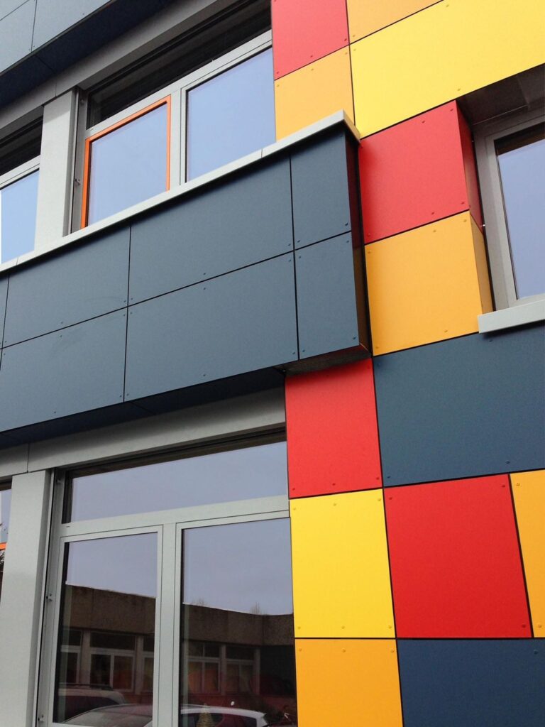 Exterior Education Sector Facade Trespa Meteon Compact A04.0.5 Zinc Yellow A04.1.7 Gold Yellow Schmidt Bedachungen School c