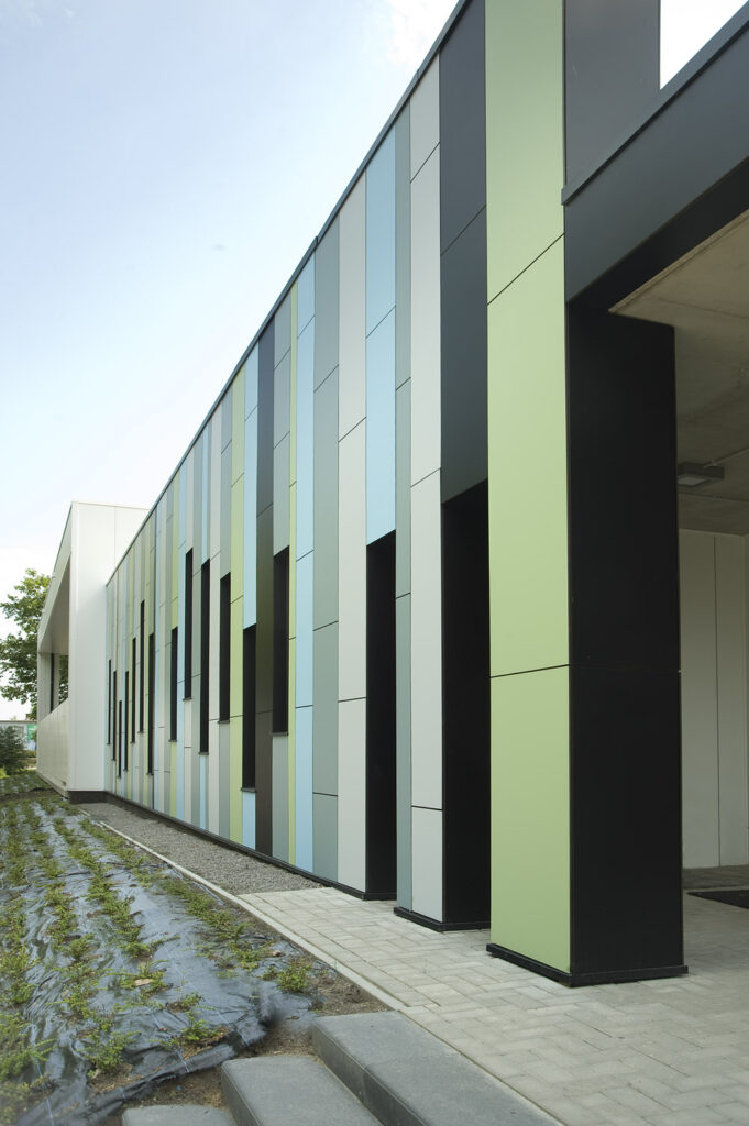 Exterior Education Sector Facade Trespa Meteon Compact Uni Colours A22.2.1 Bluish Grey A23.0.4 Mineral Blue A24.4.1 Steel Blue A37.2.3 Spring Green and A90.0.0 Black a