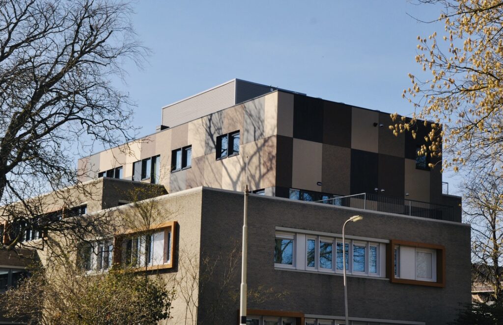 Exterior Residential Facade Trespa Meteon Compact Transformation from an office building to 28 apartments Hengelo a